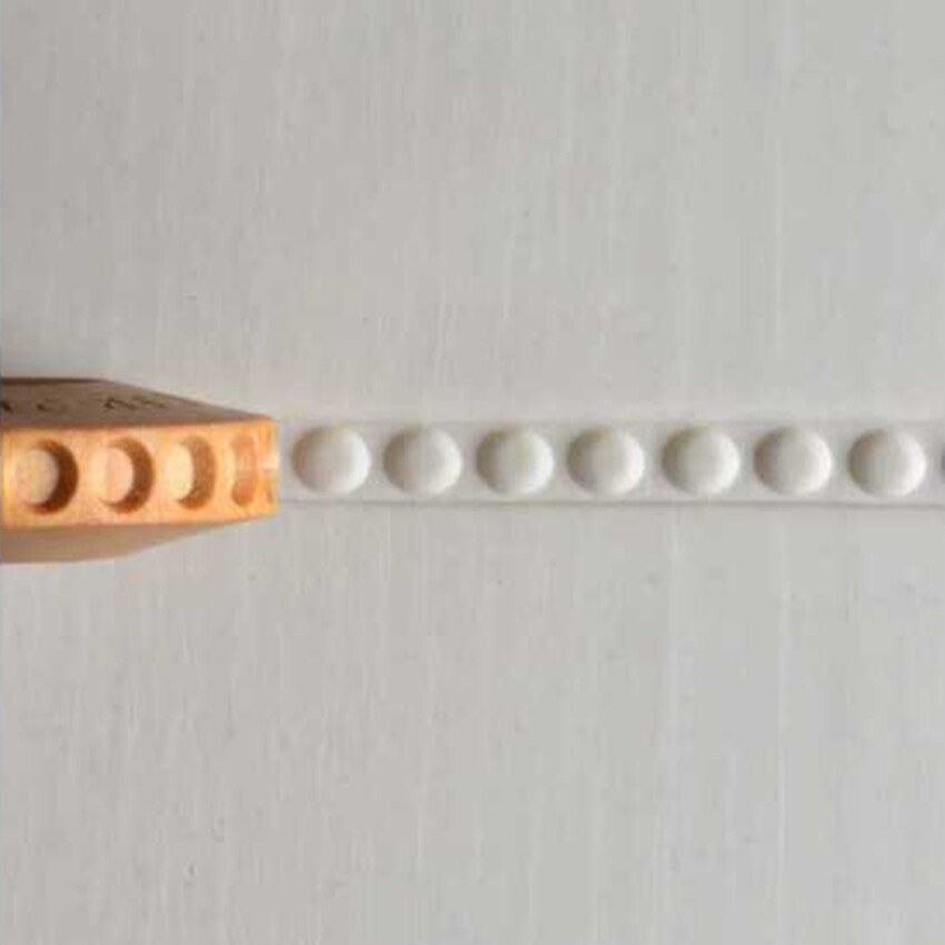 Photograph: MKM FingerRoller Design 21.  Row of Dots..