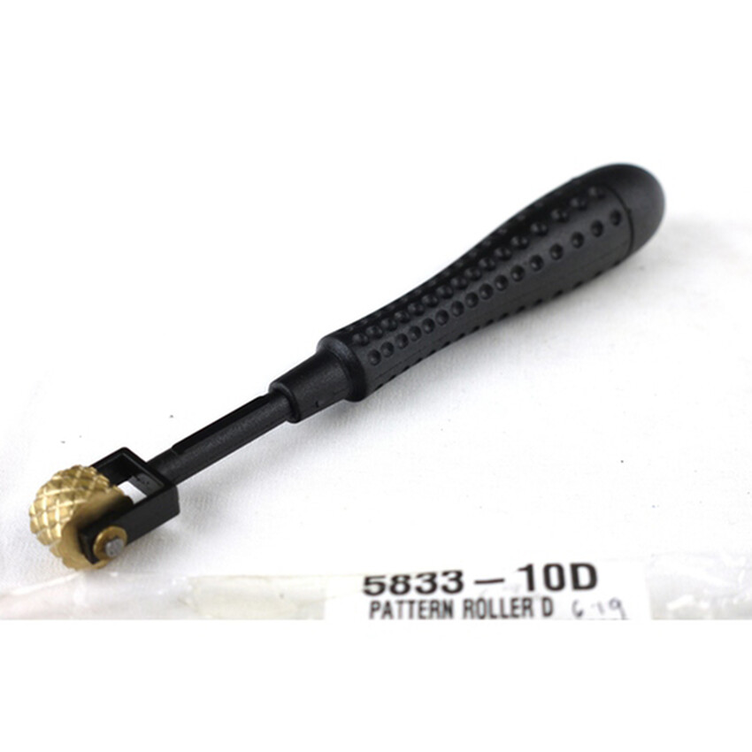 Photograph: Pattern Roller D: Plastic handle/brass head 16cm