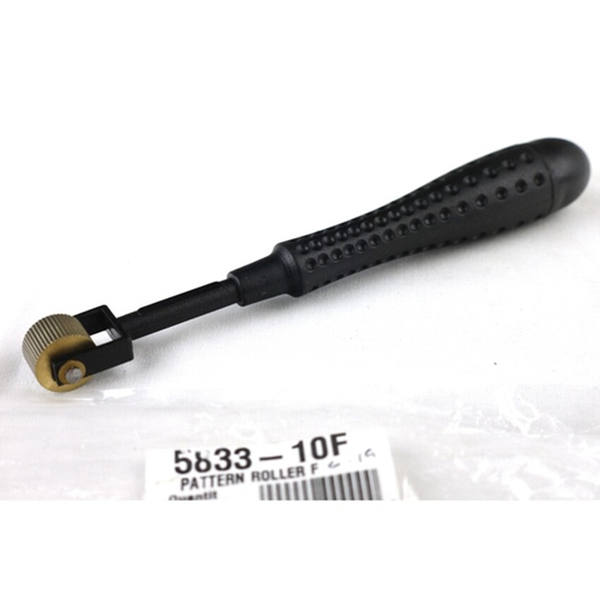 Photograph: Pattern Roller F: Plastic handle/brass head 16cm