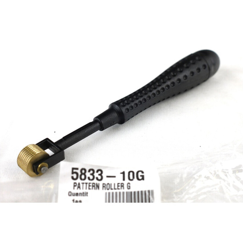 Photograph: Pattern Roller G: Plastic handle/brass head 16cm