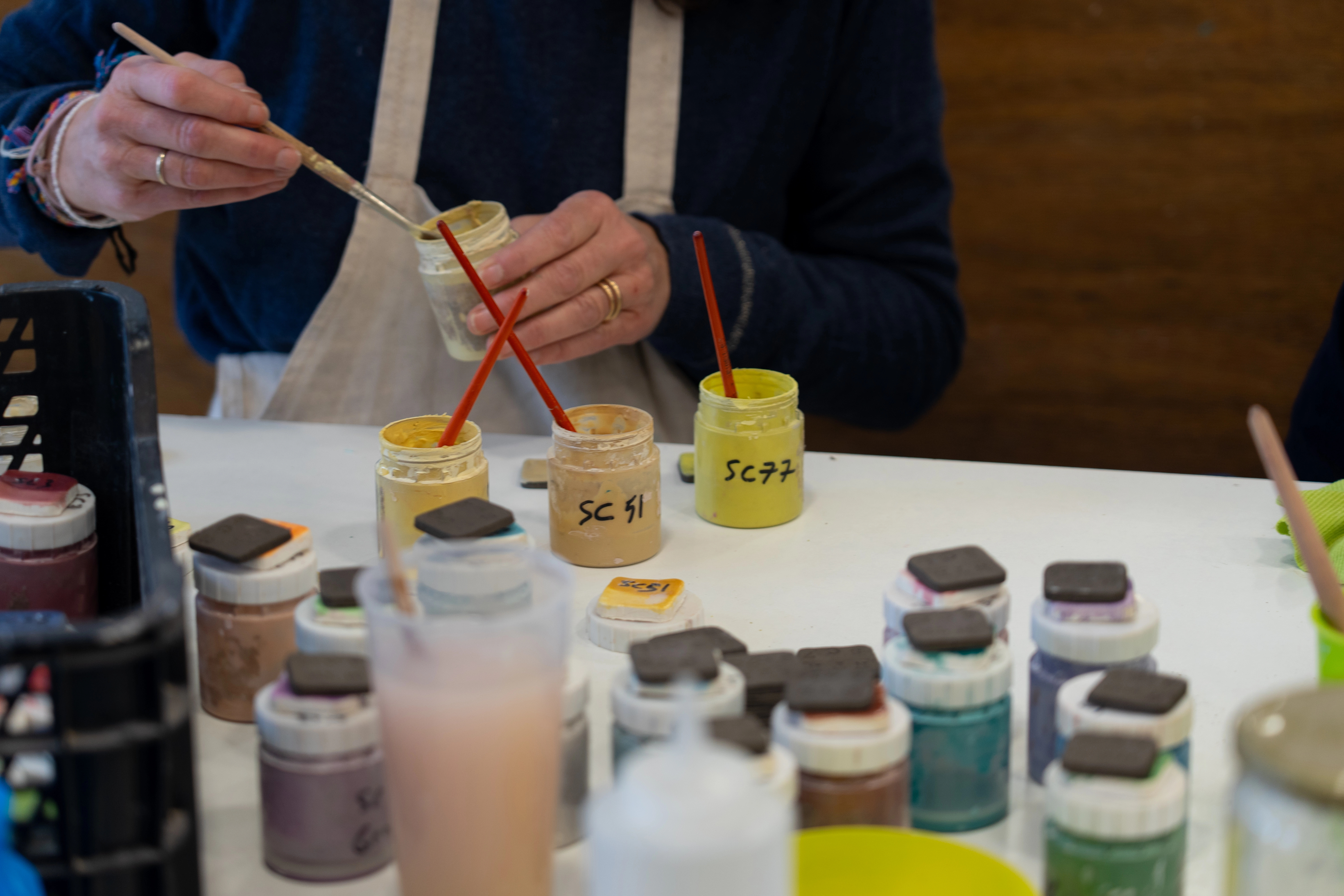artist preparing glaze