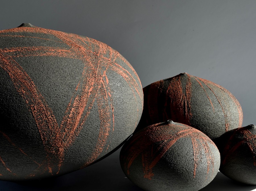 Made from Vulcan Black Stoneware Medium and Coarse and surface treated with numerous oxides and slips. Low-fired at 1020C to retain the desired fired colour.